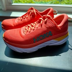 Orange HOKA sneakers